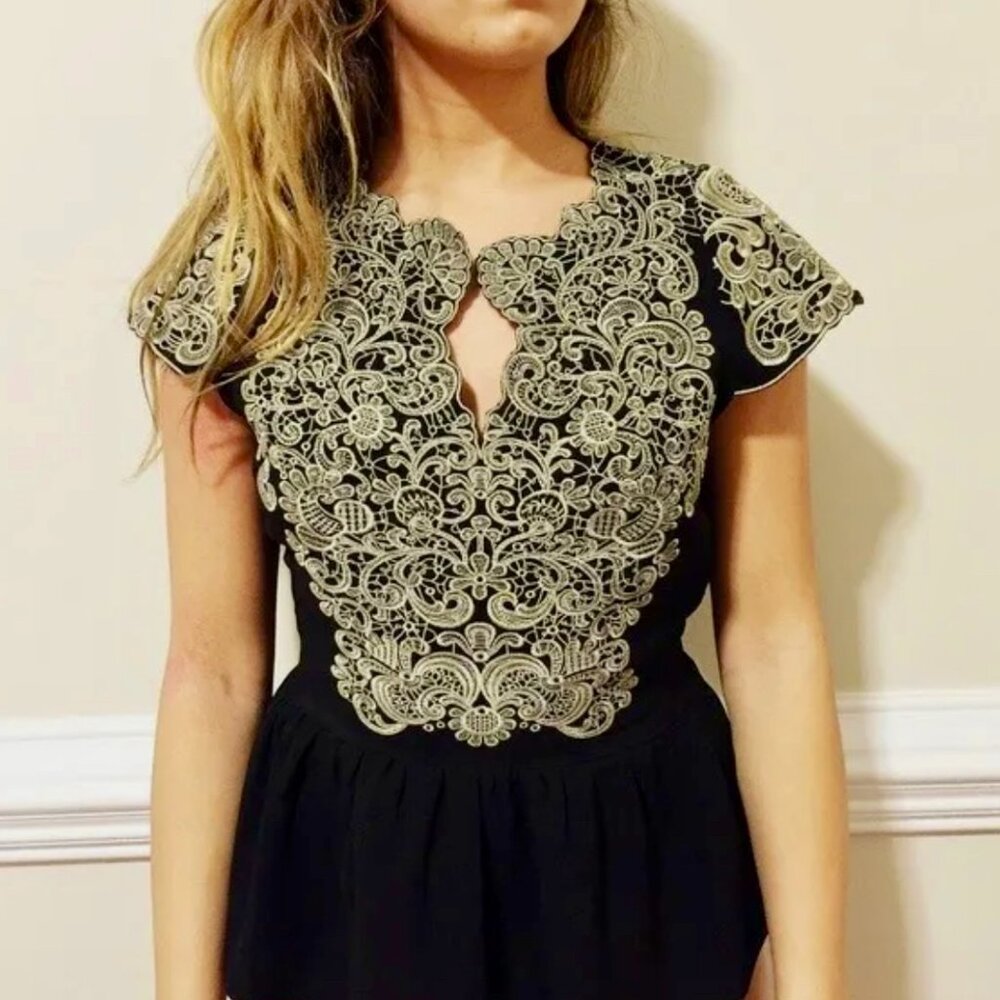 Embroidered Peplum Top